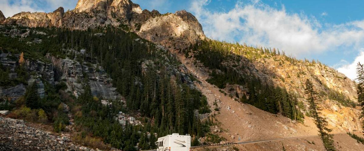 An RV driving by Liberty Bell Mountain along the North Cascades Highway in Washington state.