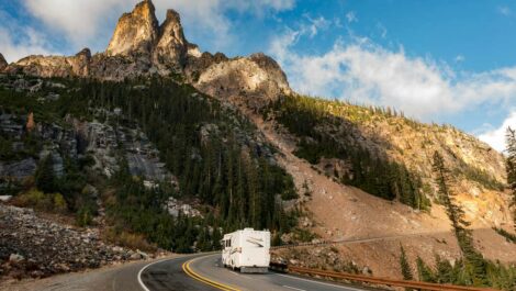 An RV driving by Liberty Bell Mountain along the North Cascades Highway in Washington state.